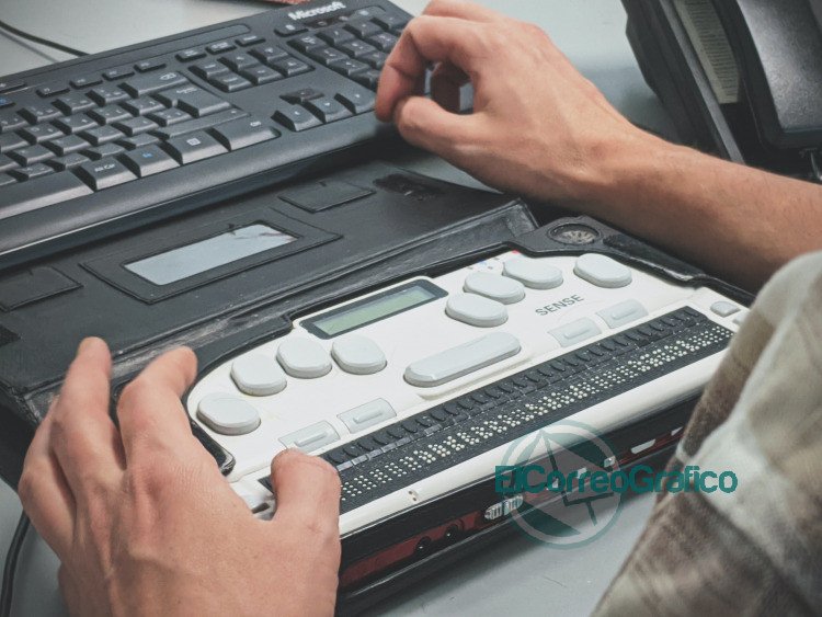 person using braille writer