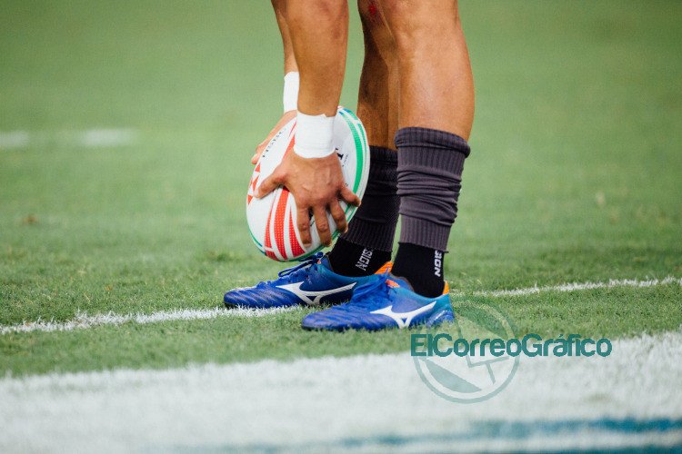 man holding rugby ball