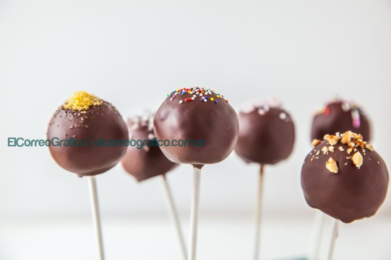 red and yellow lollipop on white surface popcakes
